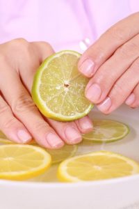 bowl of pure water with citrus fruits - hands care